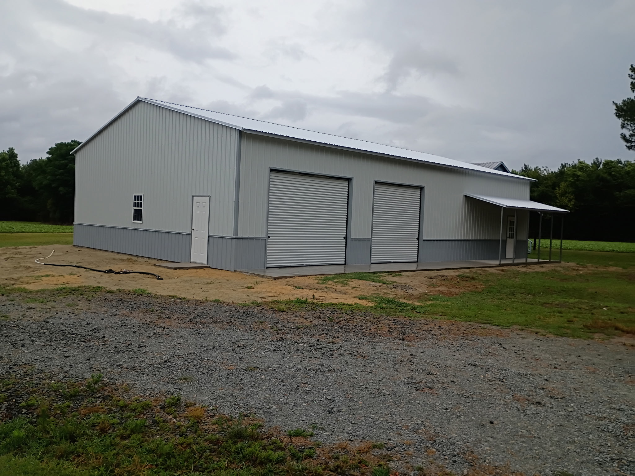 Taupe metal building with>
<div class=